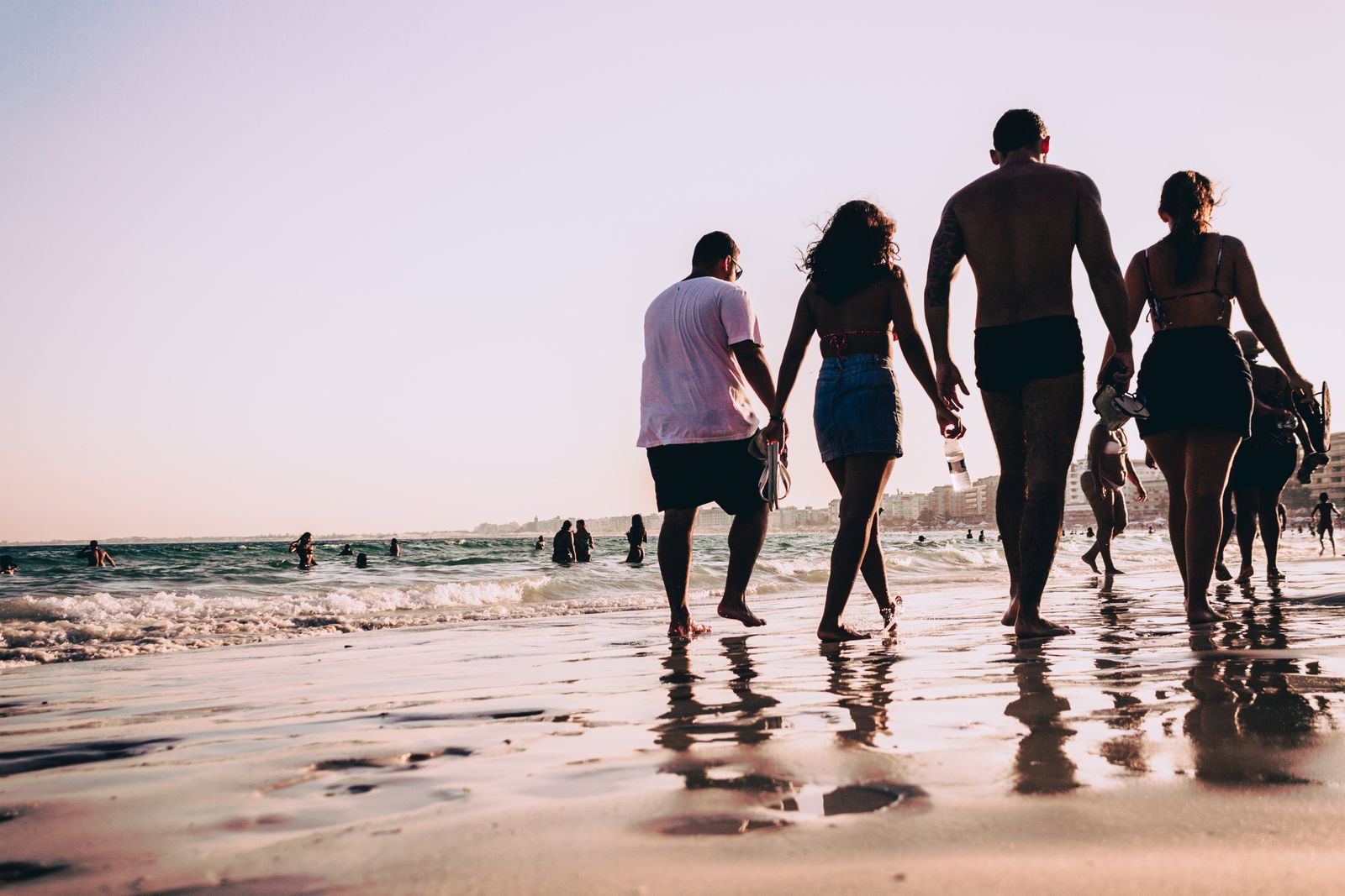 Golden-hour shoreline stroll — the daily ritual nobody schedules.